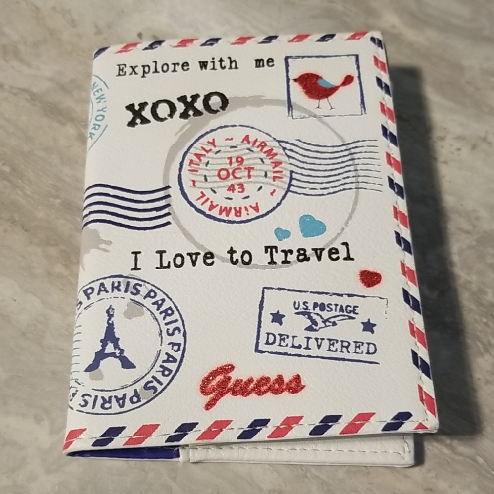 Guess Travel-Themed Passport Cover in Red, Blue, and White See Ad